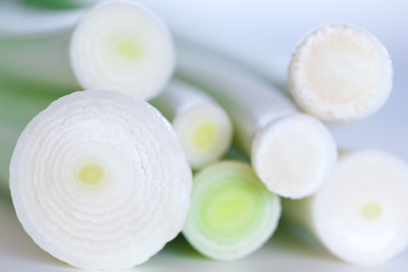 Leeks stack on cutting Board