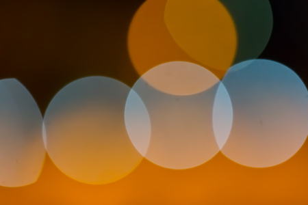 City blurring lights abstract circular bokeh on blue backgroundの写真素材