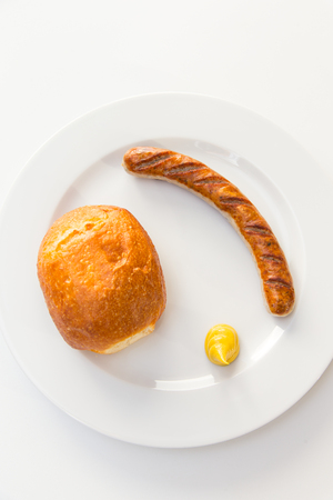Bratwurst with mustard and Breadの写真素材