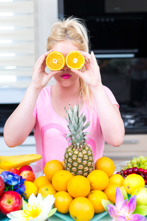 Pretty Woman in the kitchenの写真素材