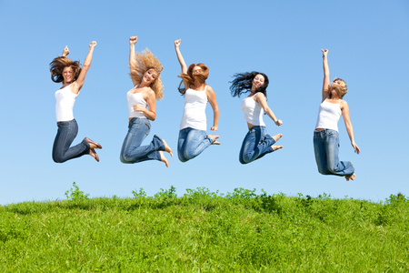 Beautiful girl group in the meadowの写真素材