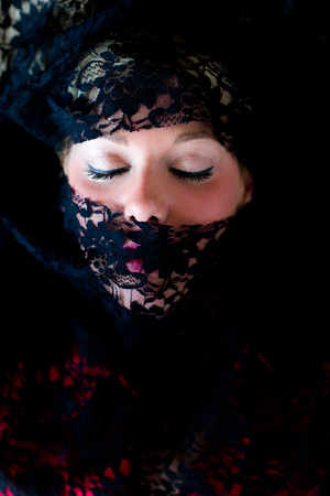 Veiled woman with blue eyesの写真素材
