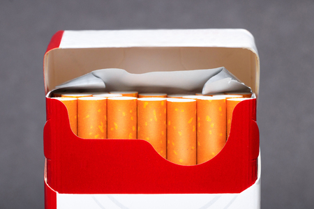 Cigarettes sticking out from the packの写真素材