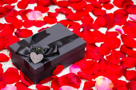 Surprise gift boxes on rose petals, valentines dayの写真素材