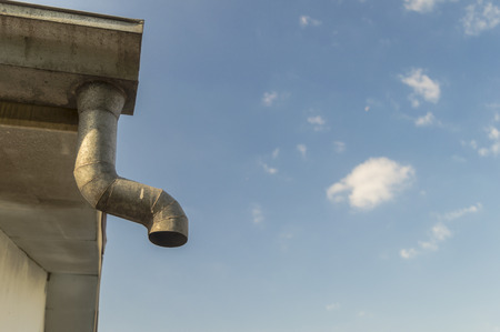 old zinc gutter under roof on the old house.の写真素材