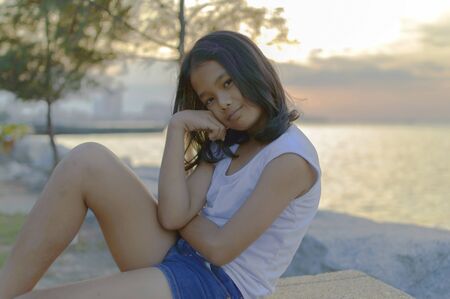 portrait of a beautiful kid outdoor In The Evening.の写真素材