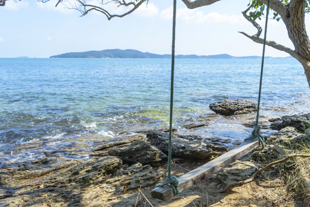 Seesaw on the beach during the day for relaxation.の写真素材