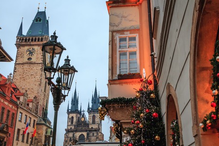 Christmas tree with toys on the background of the main square of Prague , czech republicの写真素材