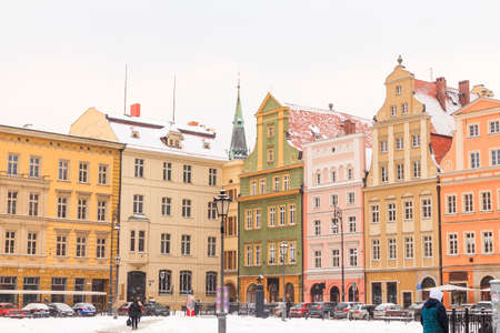winter daytime snowy old buildings of wroclaw city in polandの写真素材