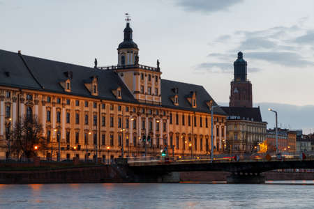 sunset over the oder river and view of the old town of wroclaw in poland in springの写真素材