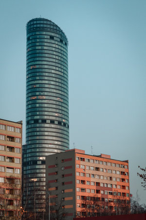 skyscraper on the background of an old building in the city of wroclaw poland in springの写真素材