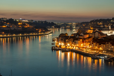 View of the Douro river and the city of Porto at sunset in autumn in Portugalの写真素材