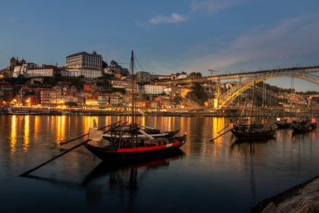 View of the Douro river and the city of Porto at sunset in autumn in Portugalの写真素材