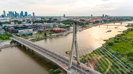 panoramic aerial view of Warsaw city at sunset in summer over the riverの写真素材