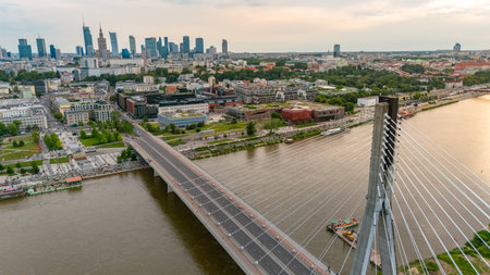 panoramic aerial view of Warsaw city at sunset in summer over the riverの写真素材