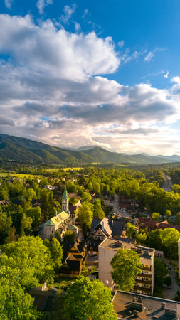 aerial view of the city of Zakopane and the city around in the evening in Poland at sunsetの写真素材