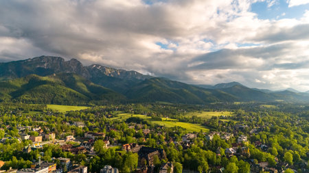 aerial view of the city of Zakopane and the area around it in the evening in Poland at sunsetの写真素材