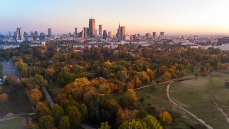 aerial view of warsaw morning panorama with park in background at dawn in autumnの写真素材