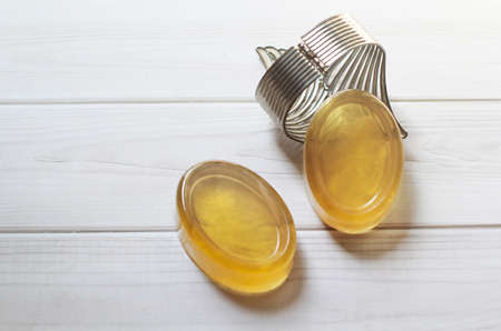 Glycerin hanmade soap., Handmade natural honey ginger soap on white wood background.の写真素材