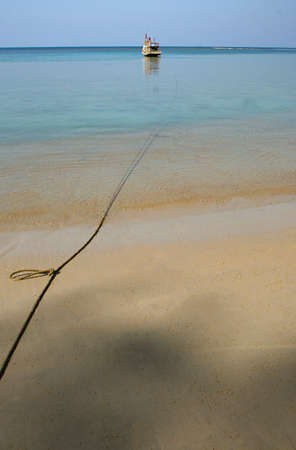 A local fishing boat on the beach., Traditional fishing boats on the coast at dawn To wait for the night fishing.の写真素材