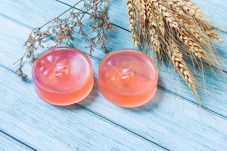 Pink glycerin soap on the background is old wood., Product care about clean and soft body skin., Daily beauty product.の写真素材
