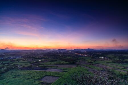 Beautiful sunset on the high mountain in countryside of Thailand.の写真素材