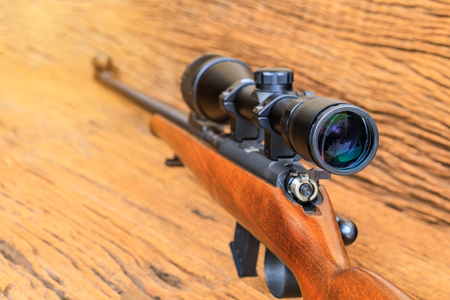 The riflescopes  on old wooden  background .の写真素材