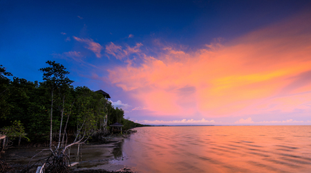 Colorful sunset on the sea in black beach, Trat province, Thailand.の写真素材