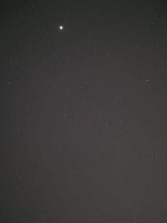 Night sky with stars and the moon in the starry sky.