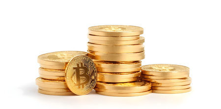 Stack of golden bitcoins isolated on white background. Cryptocurrency conceptの素材