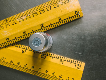 Close up of a steel measuring tape on a stainless steel background.の写真素材