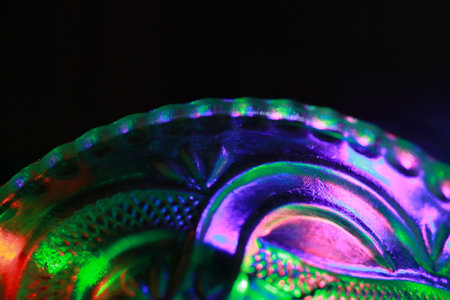 Close-up of a green and blue LED lamp on black backgroundの写真素材