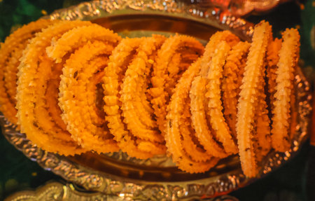 Close up of traditional indian deep fried fusilli on a plateの写真素材
