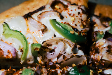 Pizza with bacon, cheese and cucumber. Selective focus.の写真素材