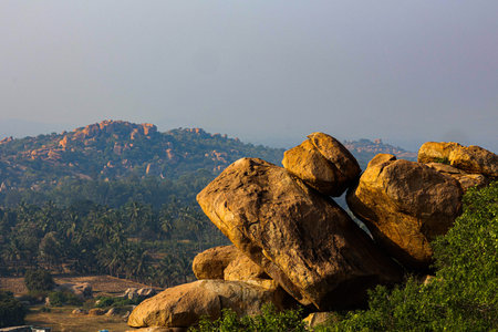 View of a scenic landscape with rocks and hills.の写真素材