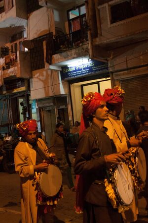 New Delhi, India - February 17 2015: Maha Shivaratri Hindu festival holiday procession. Musicians in...