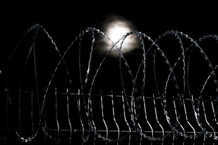 wire fence nightの写真素材