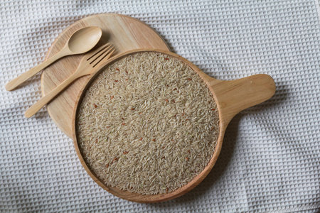 brown rice with spoonの写真素材