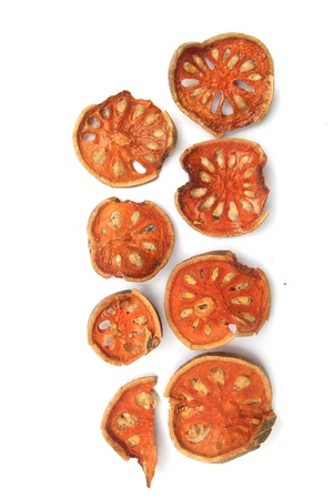 Dried bael fruit food in white background 