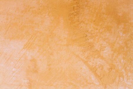 Handmade yellow wall texture backgroundの写真素材