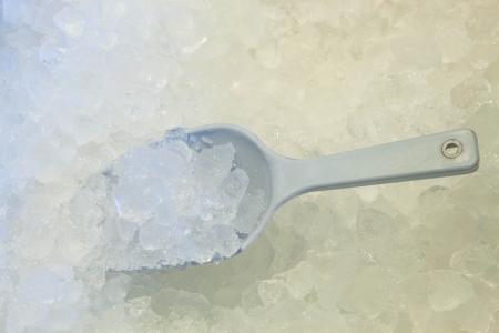 Ice scoop in fresh cool ice backgroundの写真素材