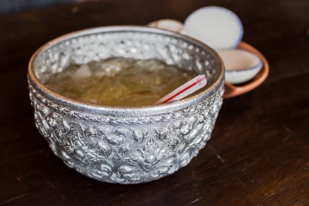 Silver bowl engraved with chrysanthemum waterの写真素材