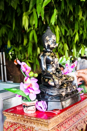 Buddhist covering buddha image with gold leafs in Thailand templeの写真素材