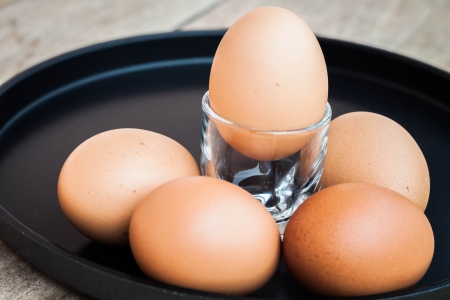 Many eggs in a black trayの写真素材