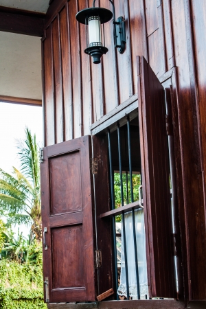 Side window porch of traditional old houseの写真素材