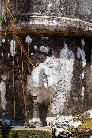 Water concrete tank with water seeping outの写真素材