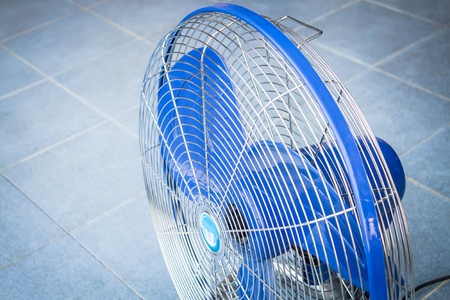 Turn off industrial fan on blue floor