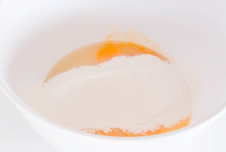 Home made bakery flour mixing with eggの写真素材