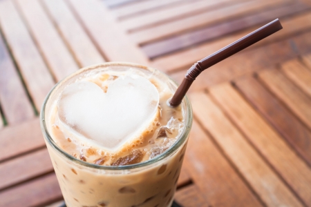 Cold coffee drink with heart ice cubeの写真素材