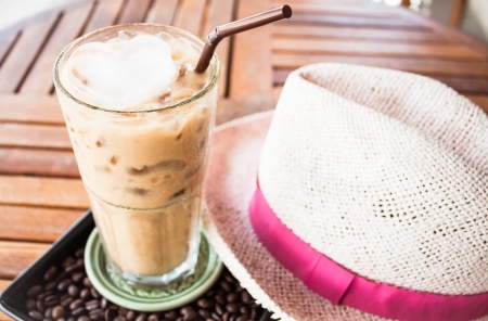 Coffee break with iced espresso at coffee shopの写真素材
